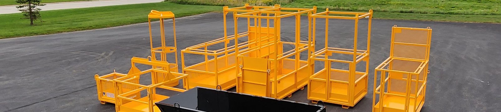 Crane man baskets shown with forklift man basket and dump box